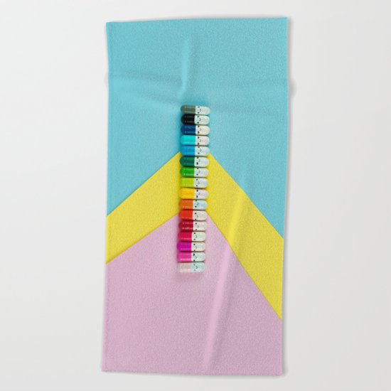 Happy little rainbow pills Beach Towel