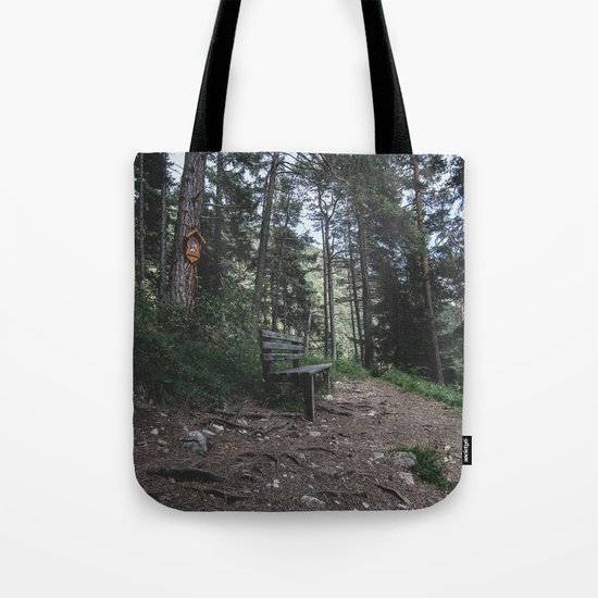 Resting bench on hiking trail in the Alps Tote Bag