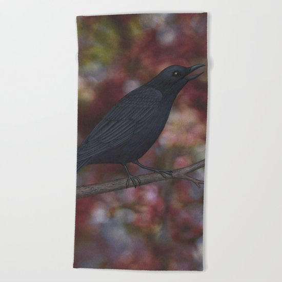 crow on a branch bokeh Beach Towel