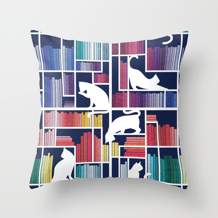 Rainbow bookshelf // navy blue background white shelf and library cats