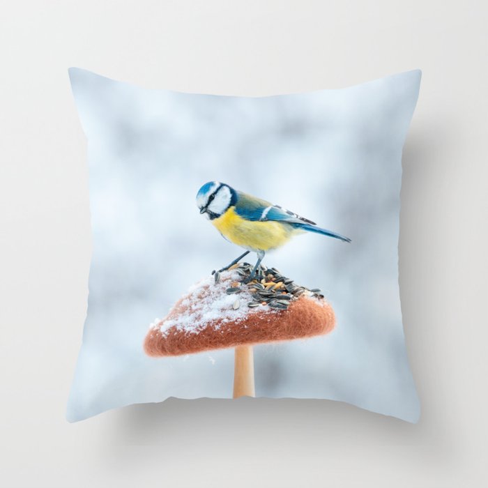 Blue tit feeding on the handmade feeder in winter snow forest. Throw Pillow