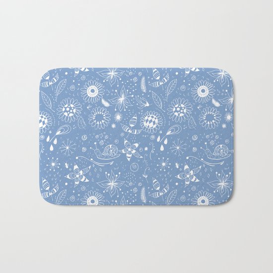 White doodle flowers pattern on blue Bath Mat