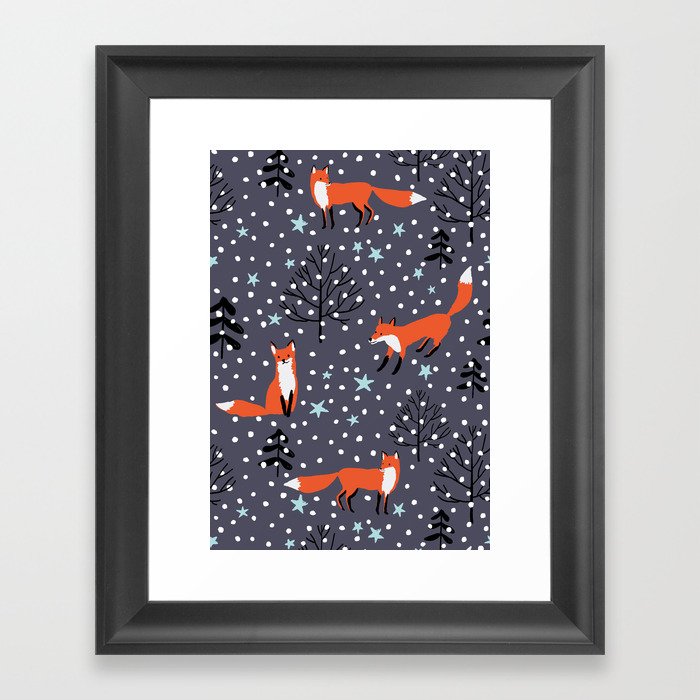Red foxes in the nignt winter forest Framed Art Print