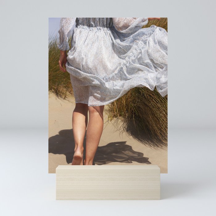 Lady in a blue dress wandering through the dunes | fashion Mini Art Print