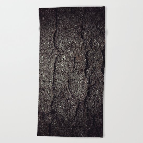 Cracked asphalt road Beach Towel