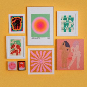 framed prints on a yellow background