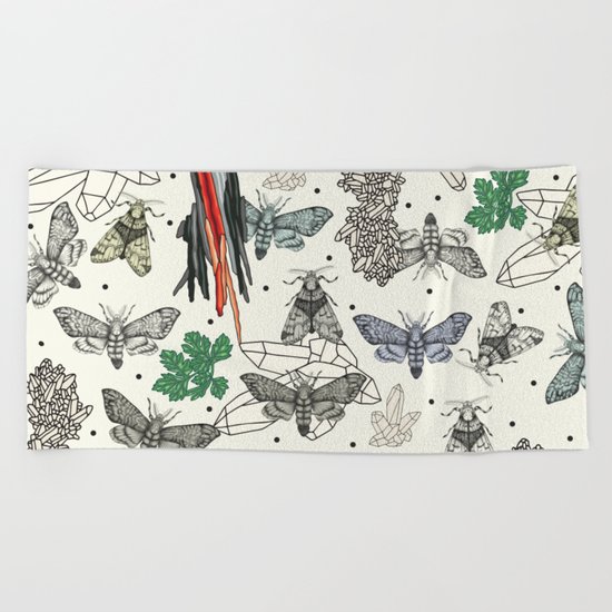 Moths and rocks. Beach Towel