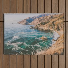 blue water on golden california coast Outdoor Rug