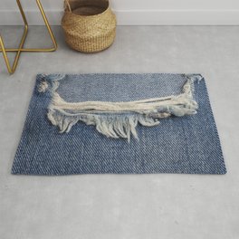 Textures ripped jeans background. Rug