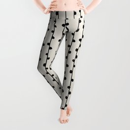 Abstract nobbly black creeper on neutral Leggings