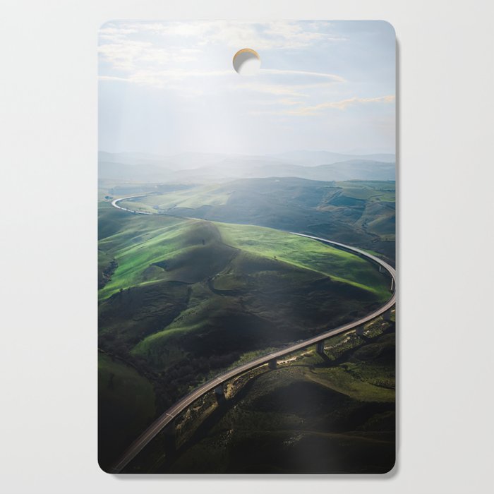 Green Hills in Italian Landscape with Road Cutting Board