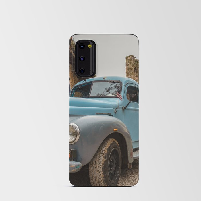 Historic blue-colored pickup parked in the streets of an historic Italian village Android Card Case