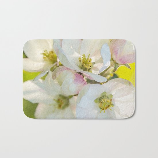 Close-up of Apple tree flowers on a vivid green background - Summer atmosphere Bath Mat