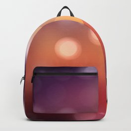 Bokeh light, shimmering blur spot lights on orange abstract background. Backpack
