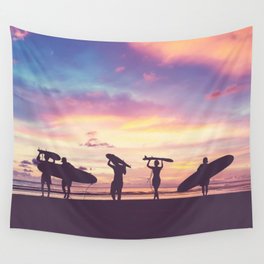 Silhouette Of surfer people carrying their surfboard on sunset beach, vintage filter effect with soft style Wall Tapestry