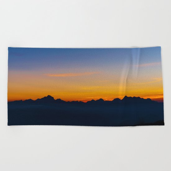 Wispy Mountain Glow Beach Towel