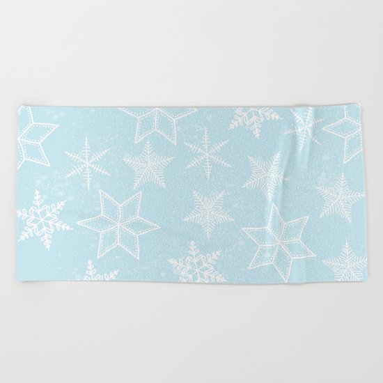 Snowflakes on light blue background Beach Towel