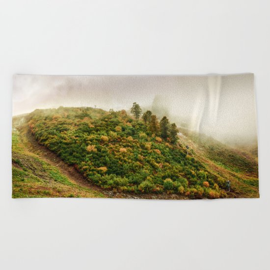 Autumn valley in the cloud Beach Towel