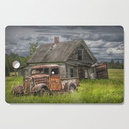 Old Vintage Pickup in front of an Abandoned Farm House Cutting Board
