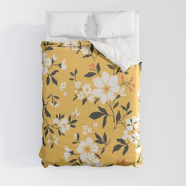 Cute floral pattern in the small flowers. Elegant print. Printing with small cream beige flowers. Light amber yellow  background. Duvet Cover