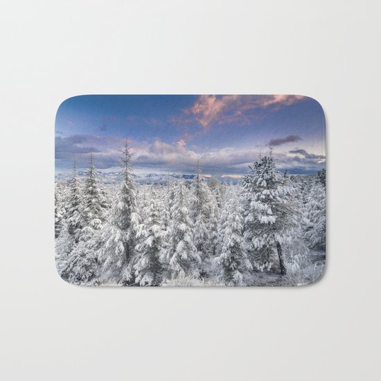 "Mountain light". Snowy forest at sunset Bath Mat