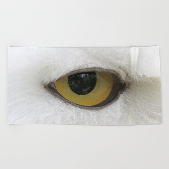 In the eye of a snow owl Beach Towel