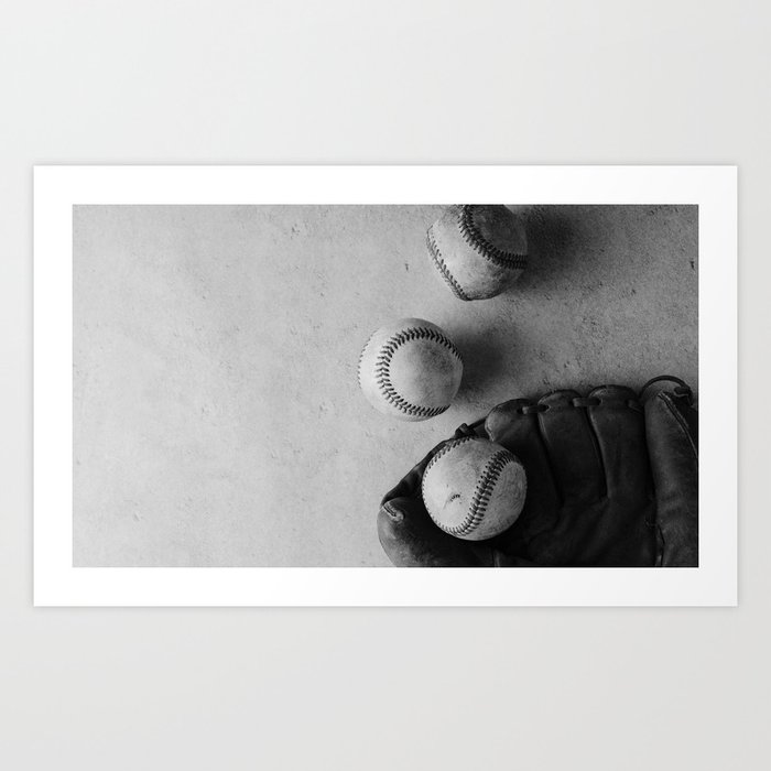 Baseballs used in game with glove in black and white Art Print