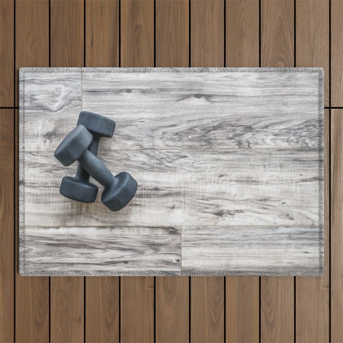 Gym fitness dumbbells weights exercise background Outdoor Rug by  Aphotosmile