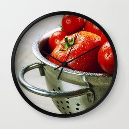 fresh tomatoes (in metal colander) and herbs on a wooden table Wall Clock