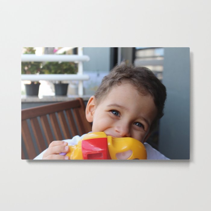 A boy smiling taking photos with a toy camera.  Metal Print