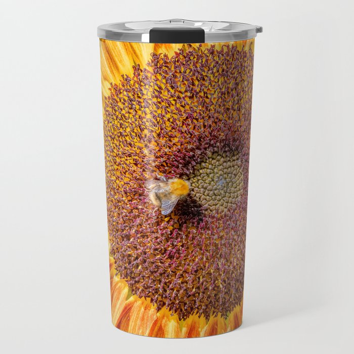 Close up view of a Sunflower bloom with a bee collecting pollen Travel Mug