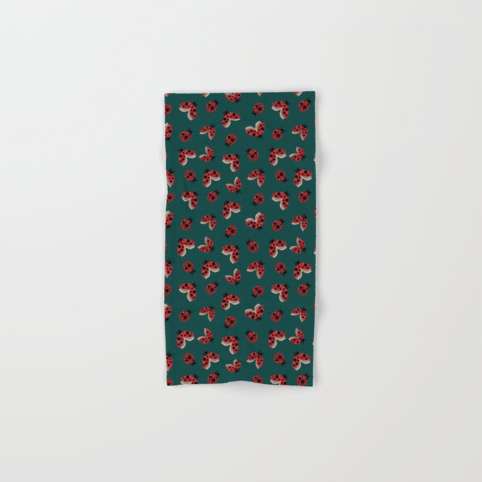 Seamless pattern with the image of flying and crawling ladybugs on a green background for printing on fabric and other surfaces Hand & Bath Towel