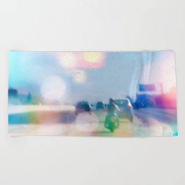 car and motorcycle on the road in the city with bokeh light Beach Towel