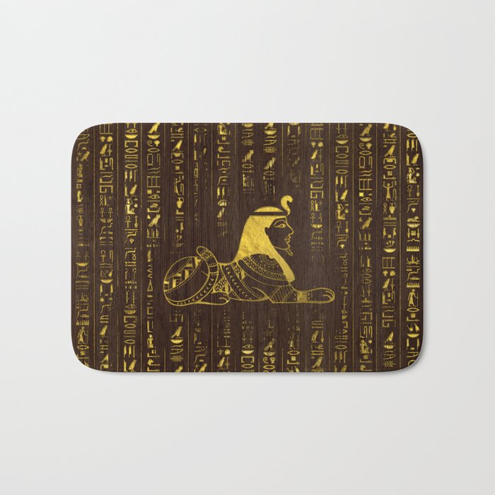 Golden Egyptian Sphinx and hieroglyphics on wood Bath Mat