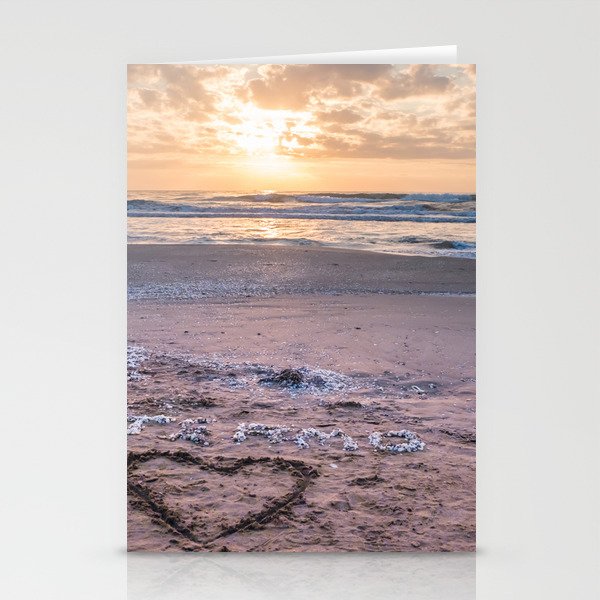 Love note Te Amo with the heart drawing on the beach at sunrise Stationery Cards