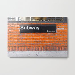 subway sign on a brick wall Metal Print
