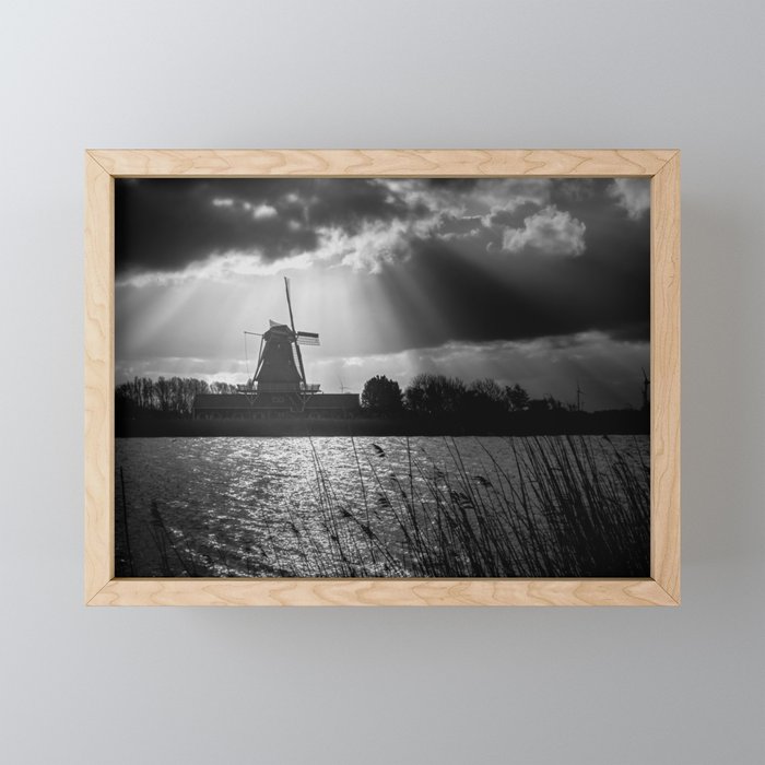 Old Dutch windmill across the water Framed Mini Art Print