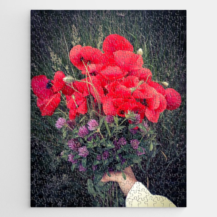 Summer red poppies and clover bloquet in woman's hand field essence Jigsaw Puzzle