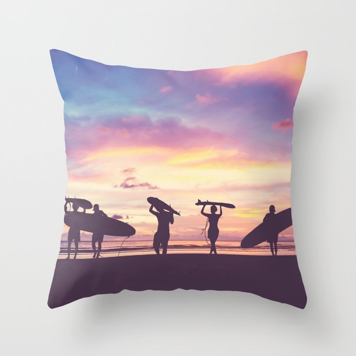 Silhouette Of surfer people carrying their surfboard on sunset beach, vintage filter effect with soft style Throw Pillow