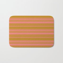 [ Thumbnail: Dark Goldenrod & Light Coral Colored Pattern of Stripes Bath Mat ]
