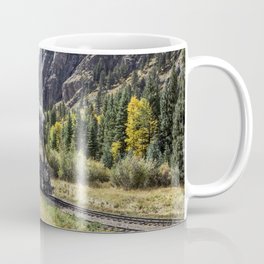 Scenic Railroad train pulled by a vintage steam locomotive chugs through the San Juan Mountains in t Coffee Mug