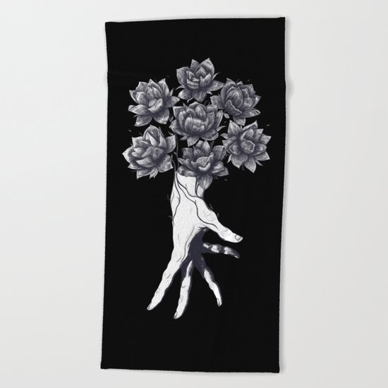 Hand with lotuses on black Beach Towel