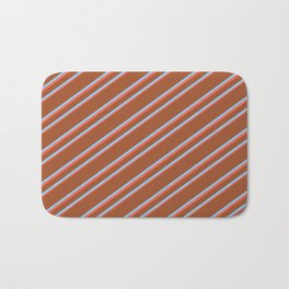 [ Thumbnail: Sienna, Light Sky Blue, and Red Colored Lined Pattern Bath Mat ]