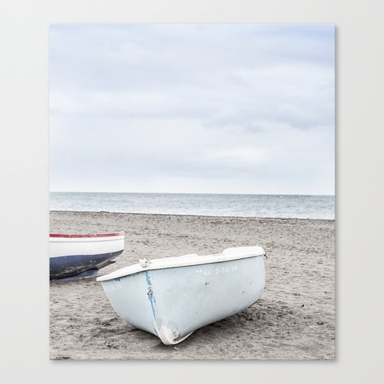 Lonely boats at the beach Canvas Print