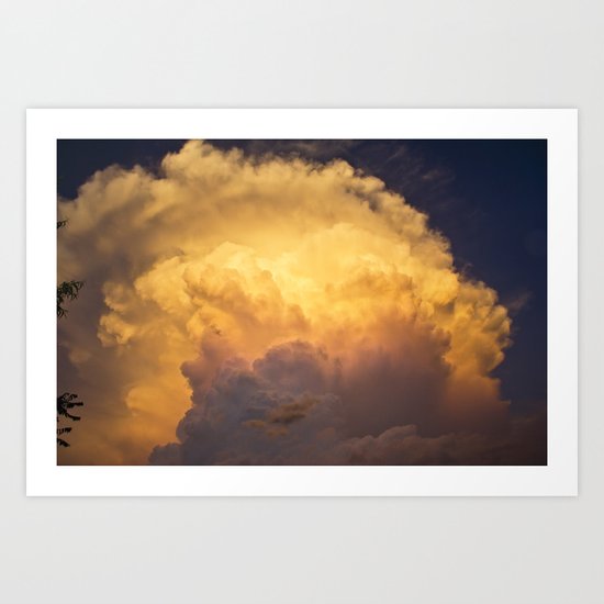 Sunset behind clouds Art Print