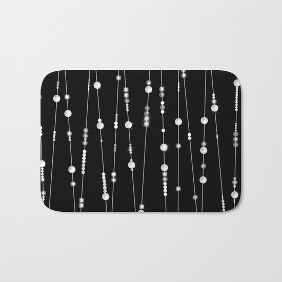 . Pearl beads on a black background Bath Mat