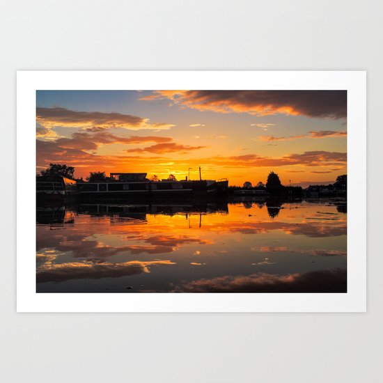 Sunrise arcross the water Art Print