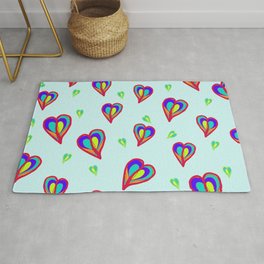 Rainbow Hearts: a fresh, colorful pattern of hearts floating on air, on a pale turquoise background Rug