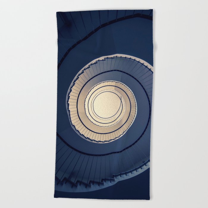 Spiral staircase in ark blue and sand tones Beach Towel