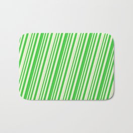 [ Thumbnail: Beige & Lime Green Colored Lined Pattern Bath Mat ]